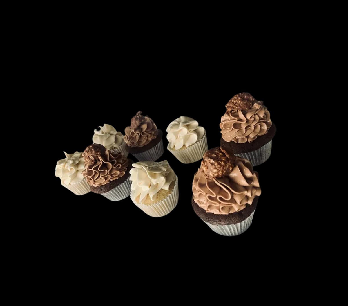 A tray of eight mini cupcakes, piped in chocolate and vanilla.