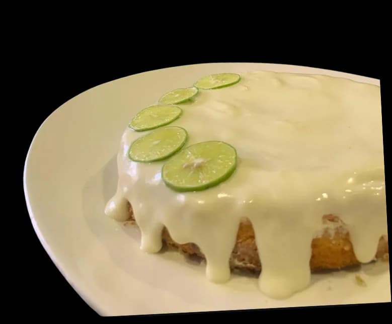 A lime cake under a thick poured glaze.