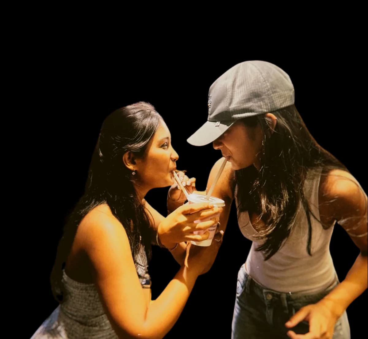 The two sisters behind Butter Club, sharing one drink through two straws.